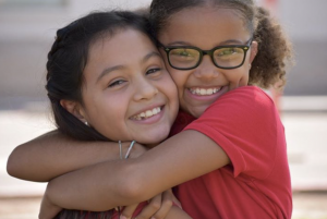 Friends reunite at Imagine Avondale Elementary during the first week of school.